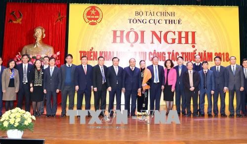 Jefe del Ejecutivo vietnamita orienta el desarrollo del ámbito del impuesto - ảnh 1