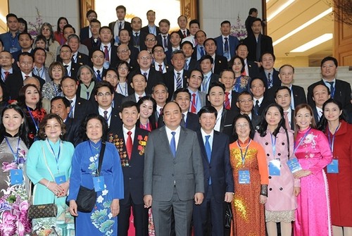 Primer ministro de Vietnam recibe a coterráneos en ultramar en vísperas del Tet 2019 - ảnh 1