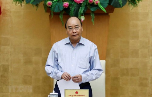 Premier vietnamita pide acabar definitivamente con el covid-19 - ảnh 1