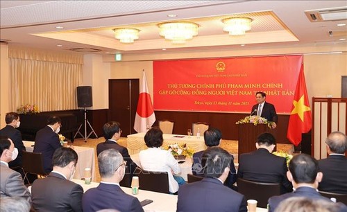 El primer ministro Pham Minh Chinh se reúne con compatriotas residentes en Japón - ảnh 1