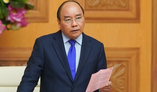 Premier vietnamita pide perfeccionar mecanismo de examen y tratamiento de Covid-19 para funcionarios en ultramar - ảnh 1
