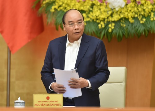 Primer ministro de Vietnam preside reunión ordinaria del Gobierno de diciembre - ảnh 1