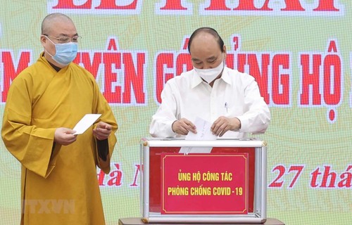 Presidente de Vietnam llama a los esfuerzos de todo el pueblo para hacer frente al covid-19 - ảnh 1