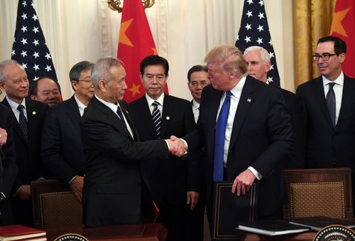 中美承诺继续落实中美第一阶段经贸协议 - ảnh 1