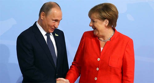   Nucléaire iranien: Poutine et Merkel favorables au maintien de l'accord  - ảnh 1