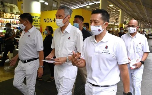 Les Singapouriens votent sous strict contrôle sanitaire - ảnh 1
