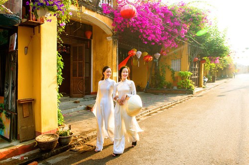 Die reine Schönheit der vietnamesischen Frauen mit dem nationalen Tracht in Fotos von Dzungart - ảnh 10