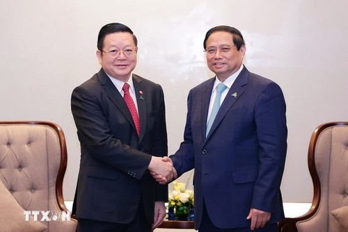 PM Vietnam, Pham Minh Chinh Menerima Sekjen ASEAN, Kao Kim Hourn  - ảnh 1
