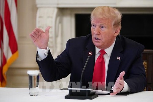 Trump threatens new taxes on companies that make goods outside US - ảnh 1