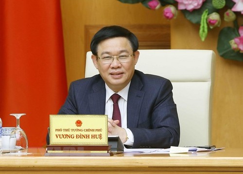 Vize-Premierminister Vuong Dinh Hue nimmt an der Unterzeichnung eines Abkommens zwischen Vietnam und den USA teil - ảnh 1