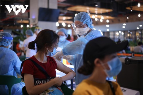 胡志明市要加速进行疫苗接种，河内调整新冠肺炎防疫措施 - ảnh 1