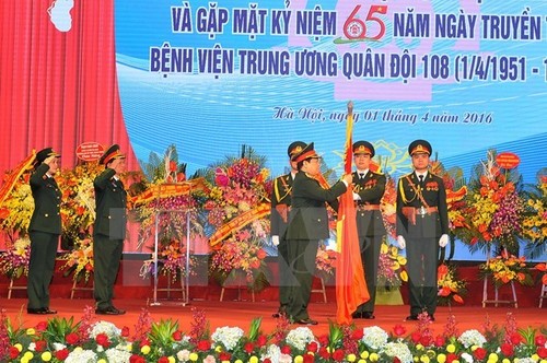 Military hospital gets credit for 65-year contribution - ảnh 1