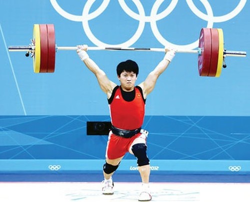 Vietnamese weightlifter promoted to 2012 Olympic bronze medal - ảnh 1