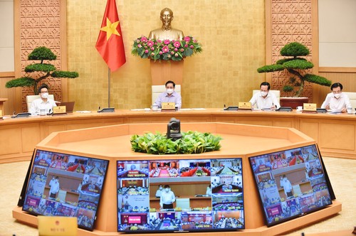Primer ministro de Vietnam pide movilizar al máximo los recursos necesarios para contener el covid-19 - ảnh 1
