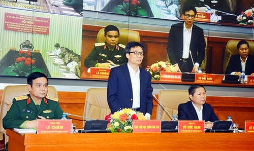 Deputi PM Vu Duc Dam menghadiri Konferensi online untuk evaluasi  sementara pelaksanaan  Proyek mencari dan mengumpulkan tulang belulang martir - ảnh 1