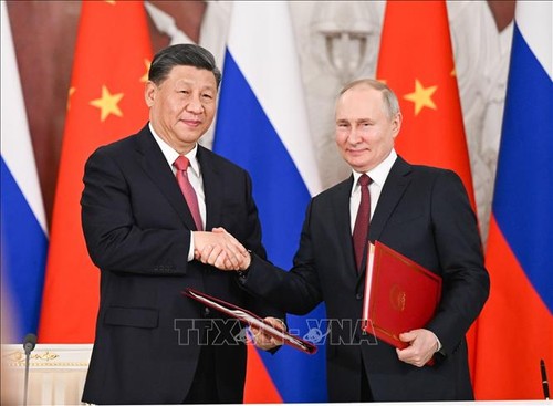 Russia, China discuss closer cooperation in multiple fields   - ảnh 1