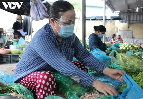 Chợ Nại Hiên Đông, Đà Nẵng mở cửa trở lại sau khi bị phong toả - ảnh 7