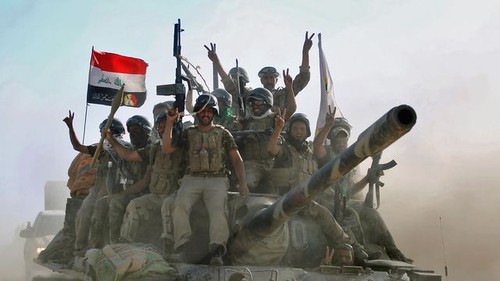 Les forces irakiennes reprennent trois quartiers du fief jihadiste de Tal Afar - ảnh 1
