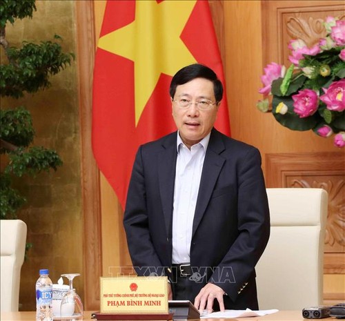 Pham Bình Minh préside une réunion sur l’intégration mondiale - ảnh 1