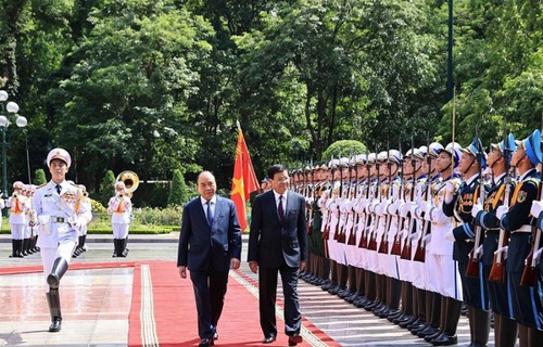 Hình ảnh lễ đón và hội đàm giữa lãnh đạo Việt Nam và Tổng Bí thư, Chủ tịch nước Lào - ảnh 4