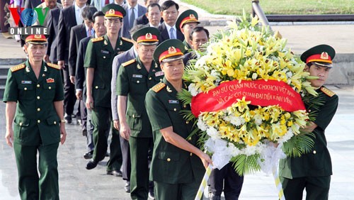 为在老挝和柬埔寨牺牲的14名烈士举行追悼会 - ảnh 1