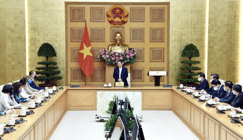 越南政府总理范明政会见联合国下属机构常驻越南首席代表 - ảnh 1