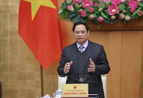 越南政府总理范明政：建设和完善体制要紧贴实践 - ảnh 1