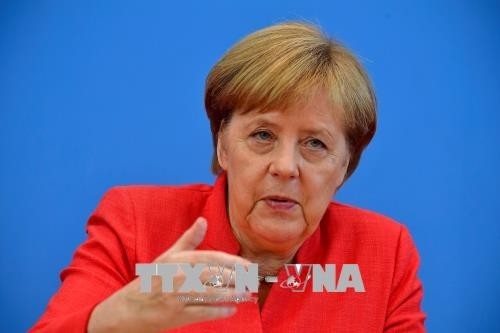 Russlands Präsident Putin trifft Bundeskanzlerin Merkel in Berlin - ảnh 1