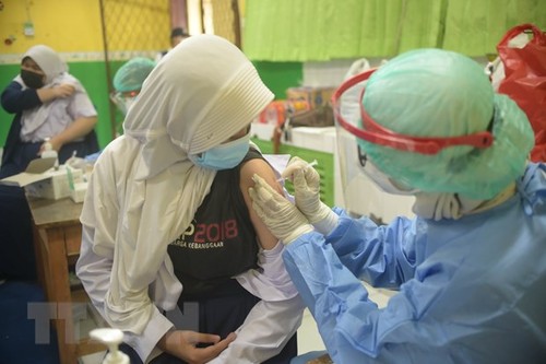 Weltgrößte Gesundheits- und Finanzorganisationen fordern Priorität für arme Länder bei Impfstoff-Lieferung auf - ảnh 1