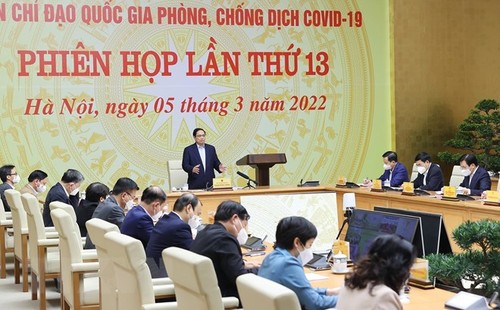 Premierminister Pham Minh Chinh fordert Ministerien und Provinzen zur Einigung der Maßnahmen gegen Covid-19 auf - ảnh 1