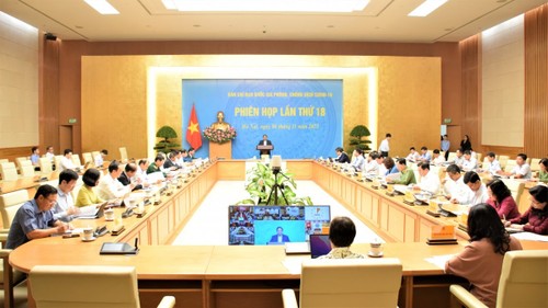 Premierminister Pham Minh Chinh leitet die Sitzung des Nationalen Verwaltungsstab gegen Covid-19 - ảnh 1