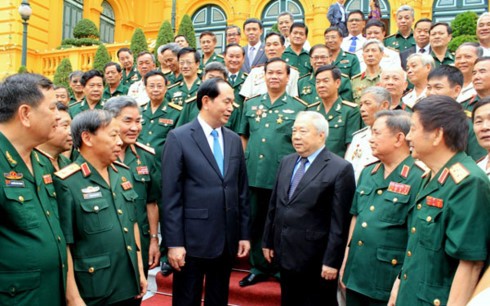 Presiden Vietnam, Tran Dai Quang melakukan pertemuan dengan para mantan prajurit sukarela di Kamboja - ảnh 1