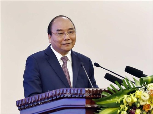 PM Vietnam, Nguyen Xuan Phuc memimpin rapat tentang pemberian penilaian terhadap program-program kerjasama dengan Laos dan Kamboja - ảnh 1