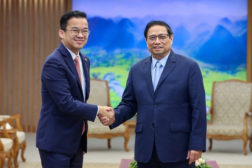 PM Vietnam, Pham Minh Chinh Menerima Presiden Korporasi Energi “Super Energy” dari Thailand - ảnh 1