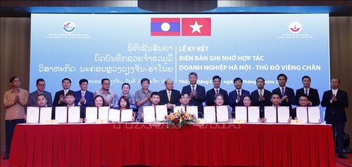 Hà Nội - Vientiane ký nhiều biên bản hợp tác tăng cường giao thương - ảnh 1