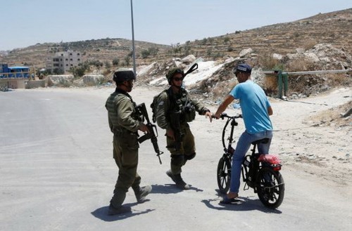 Israel melarang seluruh orang Palestina masuk negara ini - ảnh 1