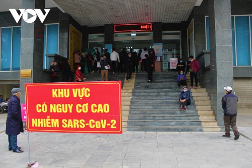 Vietnam activates stronger COVID-19 alert system as 82 more cases tested positive  - ảnh 1