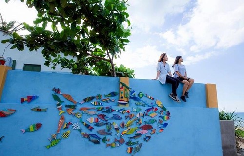 Primera aldea con pintura mural de Vietnam atrae a jóvenes - ảnh 8