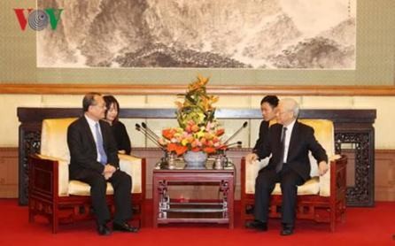 Líder partidista recibe a dirigentes de dos empresas chinas activas en Vietnam  - ảnh 1