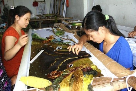 Historia de la aldea de los bordados de Quat Dong en Hanoi  - ảnh 1