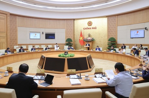Le Premier ministre Pham Minh Chinh dirige la réunion gouvernementale sur l'élaboration des lois en mars 2024 - ảnh 1
