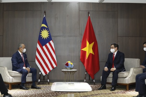 Thủ tướng Phạm Minh Chính tiếp xúc song phương với Thủ tướng Malaysia - ảnh 1