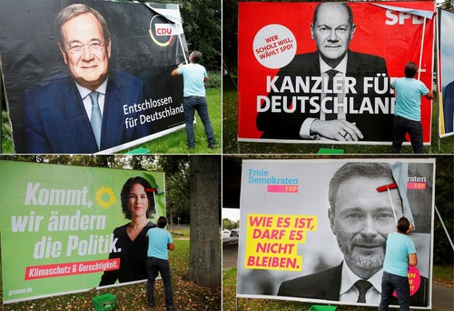 Germans vote in close election to decide Merkel successor - ảnh 1