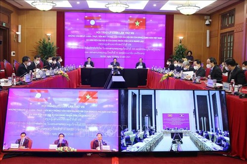Итоги обсуждения теоретических и практических вопросов коммунистическими партиями Вьетнама и Лаоса - ảnh 1