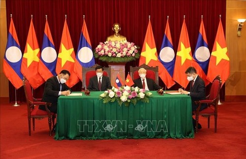 Tổng Bí thư Nguyễn Phú Trọng và Tổng Bí thư, Chủ tịch nước Lào chứng kiến Lễ ký kết văn kiện hợp tác giữa Việt Nam-Lào - ảnh 1