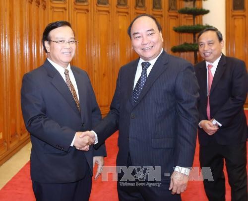 Нгуен Суан Фук принял делегацию Министерства планирования и инвестиций Лаоса - ảnh 1