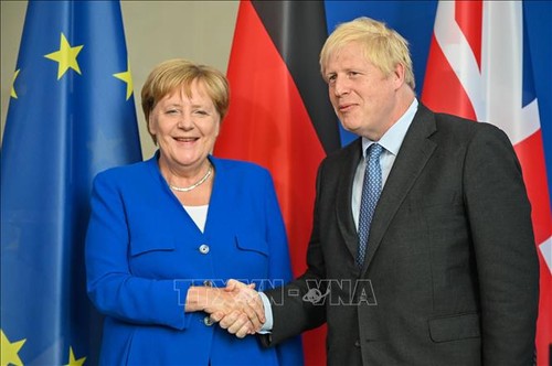 อังกฤษและเยอรมนีเห็นพ้องที่จะประสานงานกันเกี่ยวกับปัญหา Brexit - ảnh 1