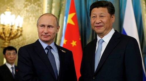 จีนให้ความสำคัญต่อความหมายของการเยือนจีนของประธานาธิบดีรัสเซีย - ảnh 1