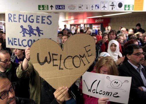French President commends Germany’s refugee policy - ảnh 1
