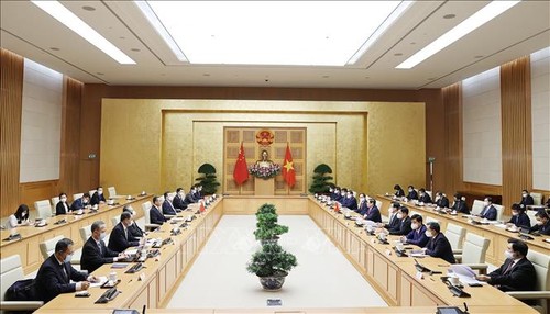 Premierminister Pham Minh Chinh empfängt den chinesischen Außenminister Wang Yi - ảnh 1